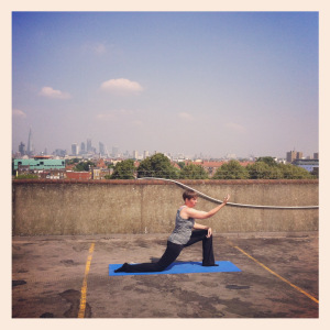 Lucy doing yoga on the rooftop in Peckham