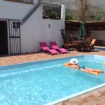 A girl floats in the pool as she relaxes on the Lucyoga and Get Lost Retreats holiday